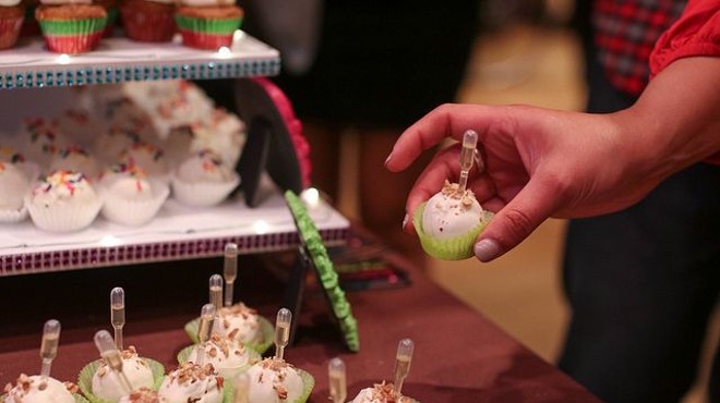 A guest indulges in a sweet and boozy treat at a prior Dulce event.
