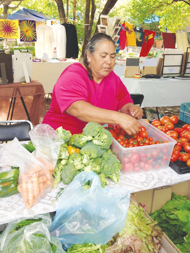Trendy señoras hawk organic eats at open-air markets - RON BECHTOL