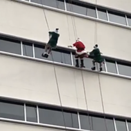 Daredevil Santa rappels down San Antonio hospital building to visit children