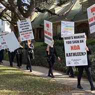 Striking San Antonio Symphony musicians picket home of the chair for the orchestra's managing body