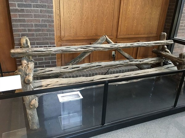The "Johnny Loves Vivian" bench is now safely behind glass at the Witte's  B. Naylor Morton Research and Collections Center. - PHOTO VIA ATLAS OBSCURA