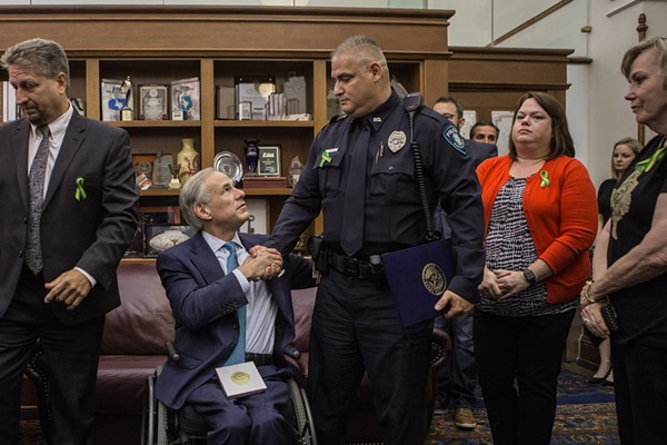 Greg Abbott shakes the hand of a participant in his school safety roundtable. - VIA GOV. GREG ABBOTT'S FLICKR PAGE
