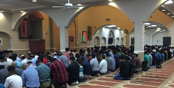 Muslims at the MCECC joined for prayer before and after they broke fast on Thursday, the last day of Ramadan. - MEGAN RODRIGUEZ