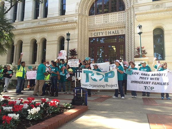 Members of the Texas Organizing Project rally outside of city hall. - TEXAS ORGANIZING PROJECT