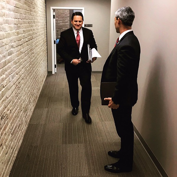 City manager candidate Erik Walsh (left) walks toward Mayor Ron Nirenberg, who voted today to approve Walsh to succeed Sheryl Sculley. - TWITTER / RON_NIRENBERG