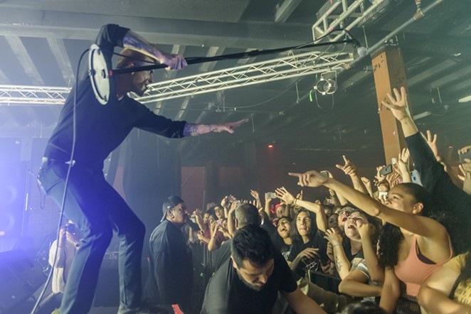 A member of Circa Survive and the crowd interact during a recent Alamo City Music Hall performance. - JAIME MONZON