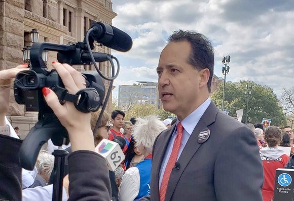 Texas Sen. Jose Menendez speaks to TV news crews outside the state capitol. - Twitter / Jose Menendez