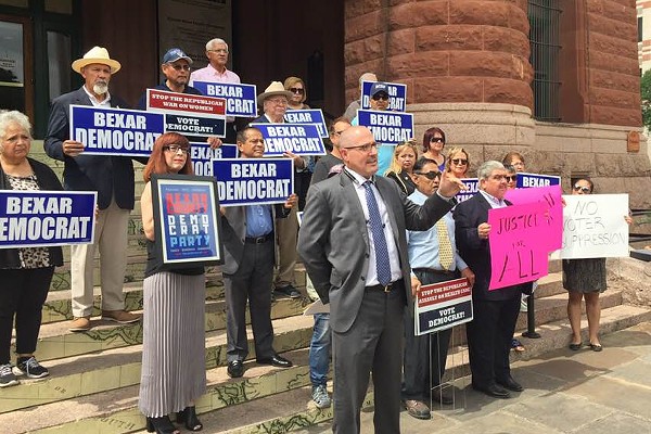 Attorney Woody Wilson speaks in front of the Bexar County Courthouse. - SANFORD NOWLIN