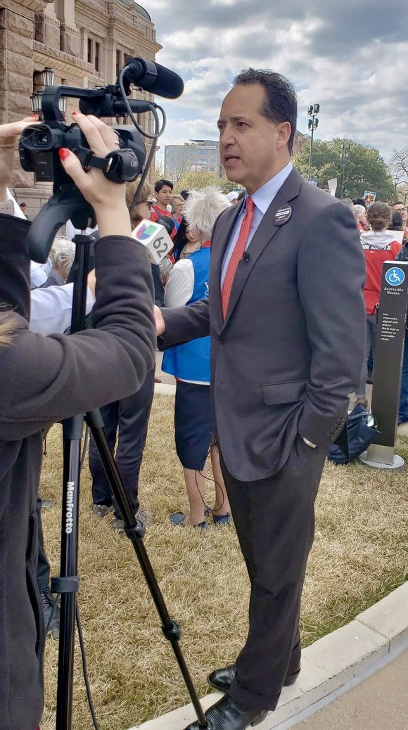 Texas Sen. Jose Menendez speaks to TV news crews outside the state capitol. - Twitter / Jose Menendez