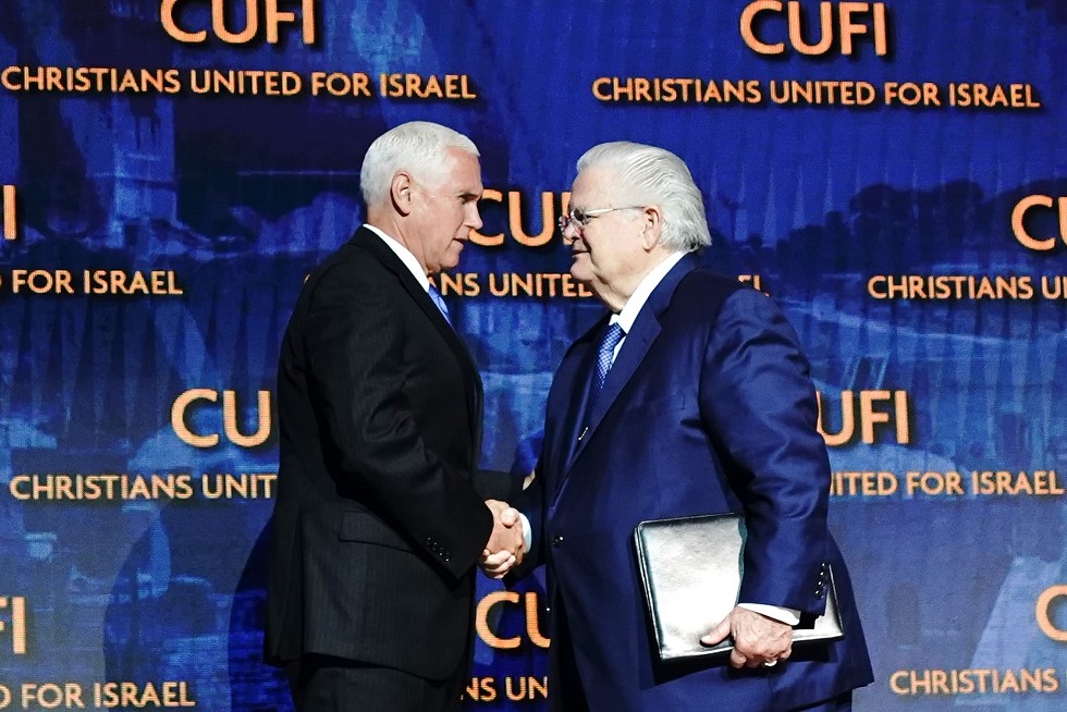 Pastor John Hagee (right) shakes the hand of Vice President Mike Pence at the CUFI summit in July. - CHRISTIANS UNITED FOR ISRAEL
