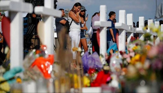 Mourners gather at a memorial for victims of the El Paso Walmart shooting. - WIKIMEDIA COMMONS / RUPERTO MILLER