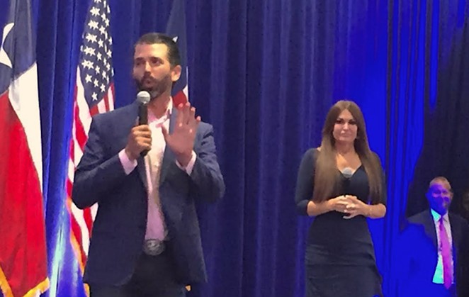 Donald Trump Jr. addresses the crowd while former Fox News personality Kimberly Guilfoyl looks on. - SANFORD NOWLIN