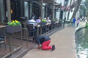 Photos Capture Man Crawling out of San Antonio River and Prostrating Himself in Front of River Walk Diners