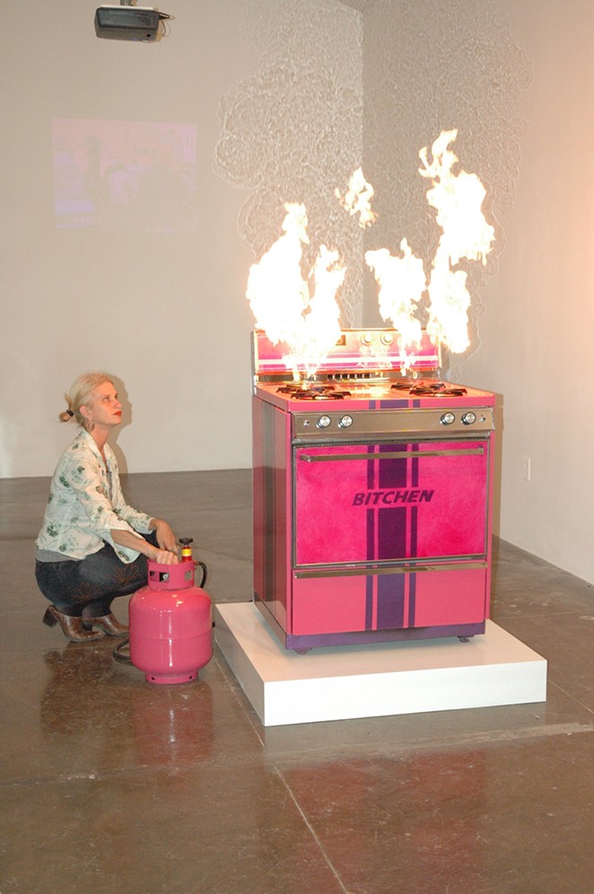 Pell in 2006 lighting up her Bitchen Stove, originally commissioned by Artpace San Antonio. - Kimberly Aubuchon