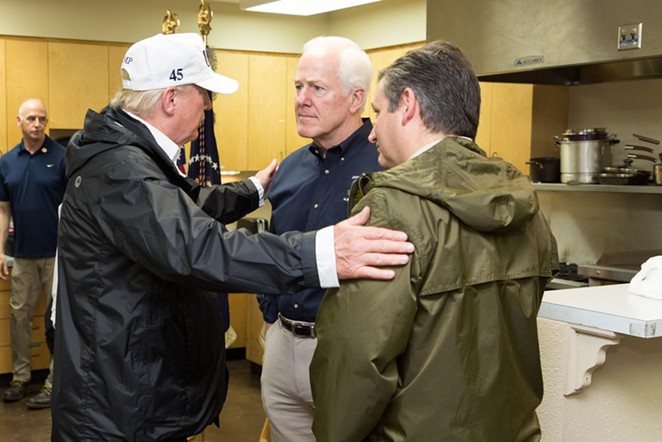 Donald Trump clasps the shoulders of Republican Senators from Texas John Cornyn (middle) and Ted Cruz (right). - THE WHITE HOUSE