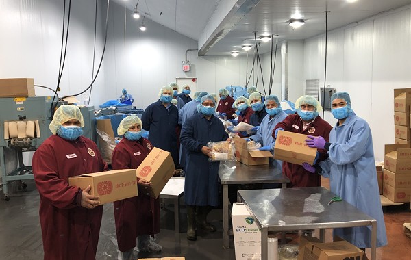 GoodHeart Brand employees suit up to distribute meal kits to the SA Food Bank. - COURTESY GOODHEART BRAND SPECIALTY FOODS