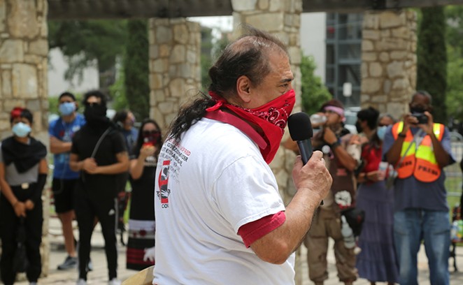 Activist Antonio Diaz addresses the crowd at a recent protest against the statue. - San Antonio Heron / Ben Olivo