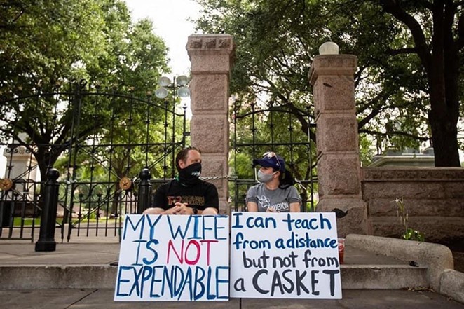 A Texas teacher and her husband attend a recent protest over the state's school reopening plan. - Twitter / @beckilaoshi