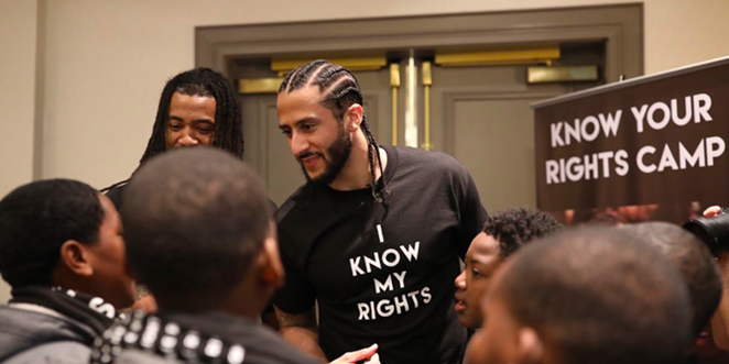Colin Kaepernick meets with young people at one of his Know Your Rights camps. - Twitter / @Kaepernick7