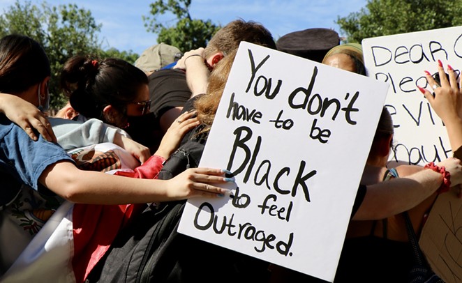 Protesters gather together at a San Antonio Black Lives Matter protest this spring. - JAMES DOBBINS