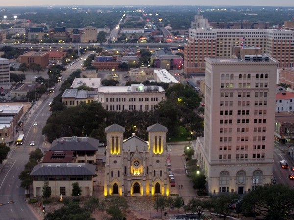 As part of a deal to bring a new skyscraper to downtown San Antonio, the Municipal Plaza Building to the right of the San Fernando Cathedral in this photo will be sold to a developer for residential and retail space. - Wikimedia