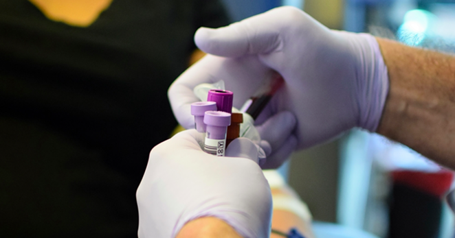 A technician handles vials of blood during a donation drive. - WIKIMEDIA COMMONS / VEGASJON