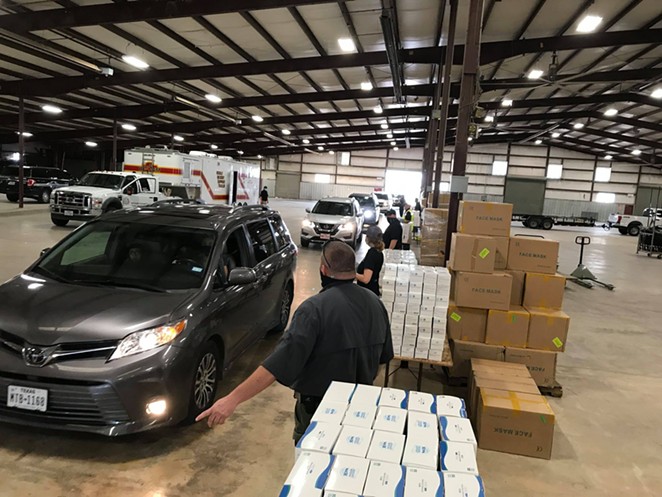 County workers prepare to hand out masks at a distribution event in - FACEBOOK / BEXAR COUNTY, TEXAS