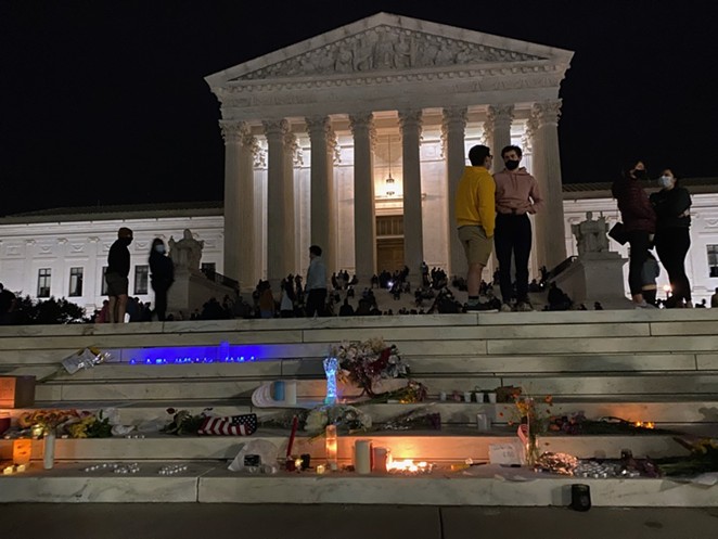 People leave memorials on the steps of the U.S. Supreme Court following the the death of Ruth Bader Ginsburg. - WIKIMEDIA COMMONS / STUART SEEGER