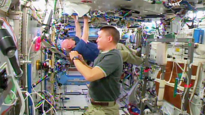 NASA Astronauts Scott Kelly and Kjell Lindgren doing space stuff, no big deal. - NASA TV