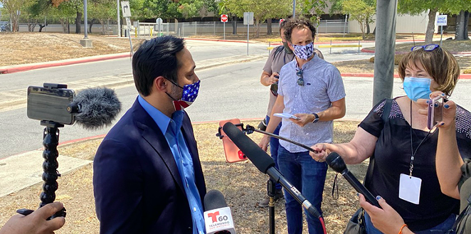 U.S. Rep. Joaquin Castro speaks to reporters outside San Antonio's central mail distribution site. - SANFORD NOWLIN