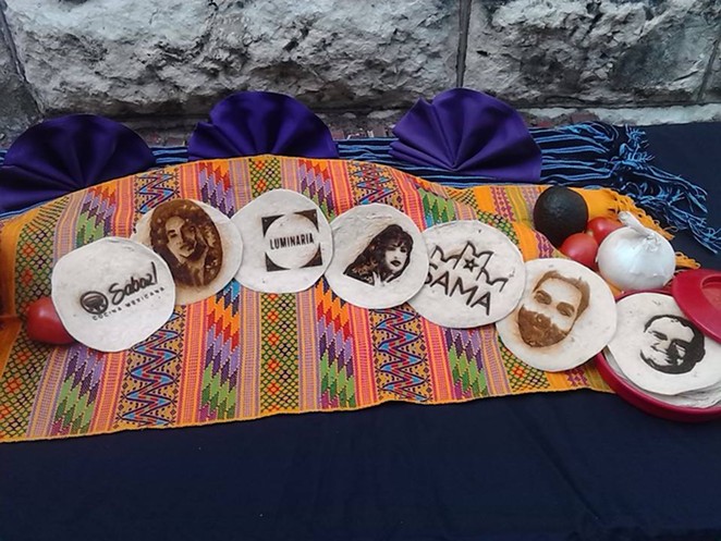The Convergent Media Collective used a laser to burn images onto tortillas. They hope to raise money for a new laser to use during Luminaria 2015. The plan is to set up a photo booth so people can have their images burned onto tortillas. - Photo by Mark Reagan