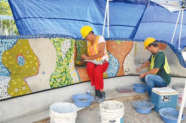 Dedicated workers have set thousands of pieces of glass and porcelain at Yanaguana Garden. - Bryan Rindfuss