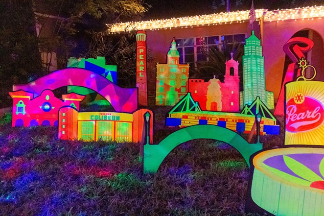 The fluorescent holiday decor features San Antonio landmarks including Freeman Coliseum and La Torcha de Amistad. - REDDIT / U/DAWZRDGUNDLACH