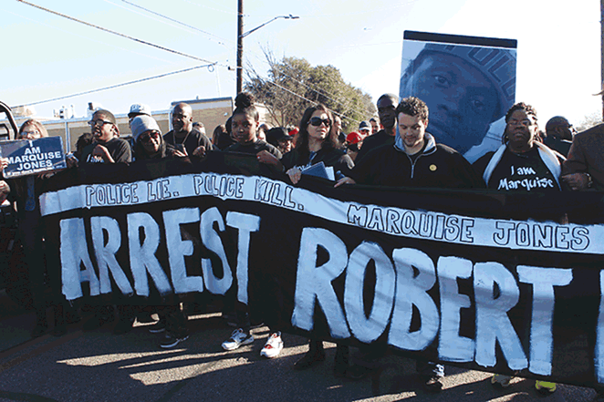 Activists called for SAPD Officer Robert Encina’s arrest at the MLK Day march.