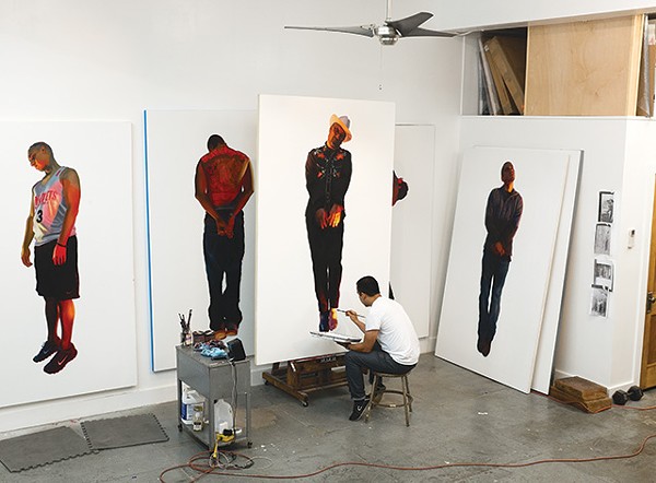 Vincent Valdez in the studio, working on 'The Strangest Fruit', 2013, which explores the history of lynchings of Mexicans in the Southwest. - COURTESY OF THE ARTIST