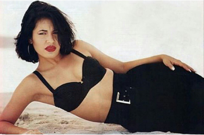 Selena's highly coveted look: red lips, dark locks, bustiers, and high-waisted pants. - COURTESY