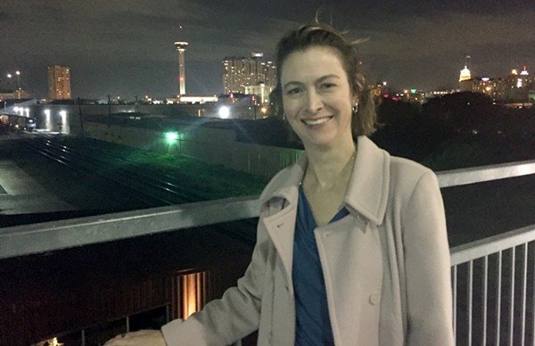 Luminaria executive director Kathy Armstrong takes a moment to enjoy the view from the Hays Street Bridge in Downtown East. Luminaria 2016 will take place in the eastside neighborhood this November.