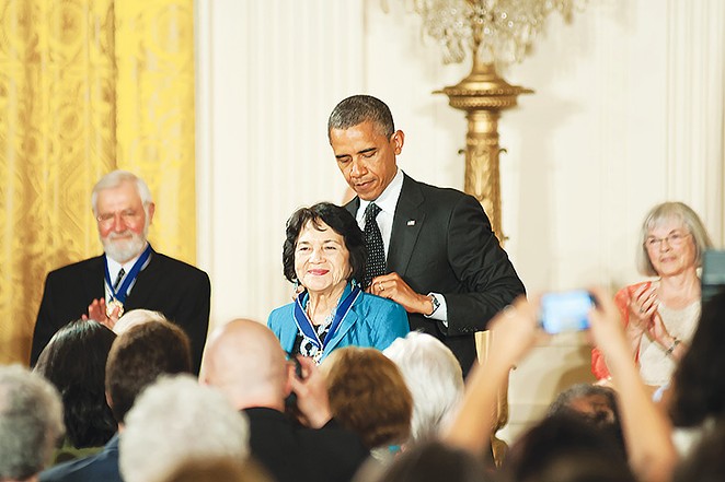 President Barack Obama awards Dolores Huerta in 2012 with a Medal of Freedom.