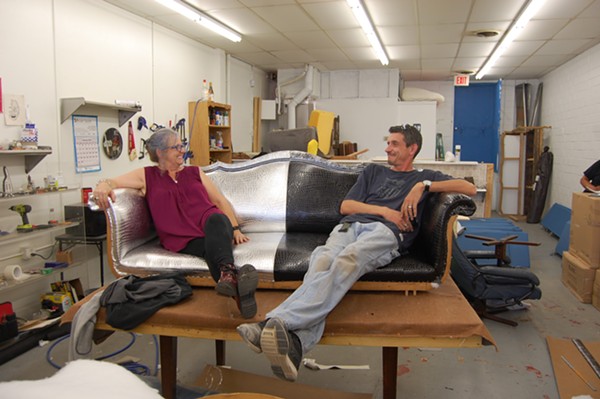 This photo is a little more than a week old. It shows Fiona Arecchi, left, and Lee Williams, right, sitting on a work in progress: the Fiesta Cornyation throne. - Mark Reagan | San Antonio Current