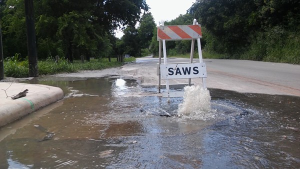 Sewage flows out of a manhole on Holbrook Road. - MICHAEL MARKS