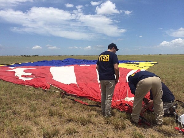 National Transportation Safety Board investigators at the site of a fatal hot-air balloon crash that killed 16 people in Lockhart, Texas. - National Transportation Safety Board