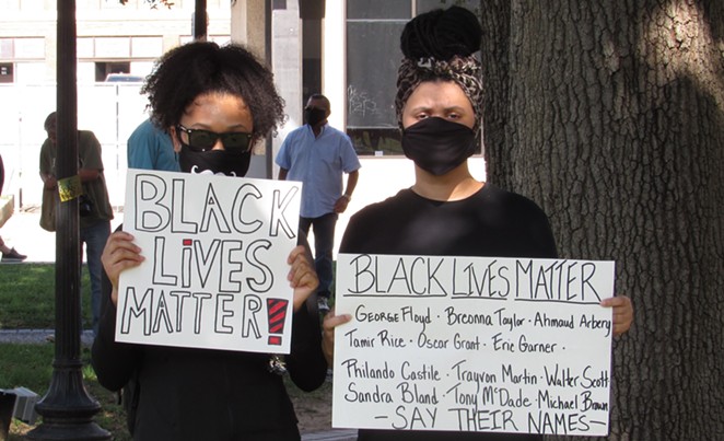 San Antonio protesters hold up signs at a 2020 march against police brutality. - SANFORD NOWLIN