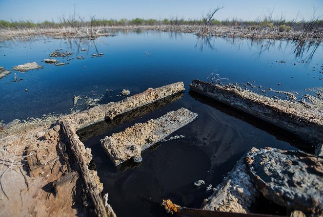 Brackish water flows from an unplugged abandoned well outside of Imperial in Pecos County. Texas reported more than 6,000 documented "orphan" oil wells in 2019, almost all on private land, but some experts believe that's an underestimate. - Texas Tribune / Rafael Aguilera