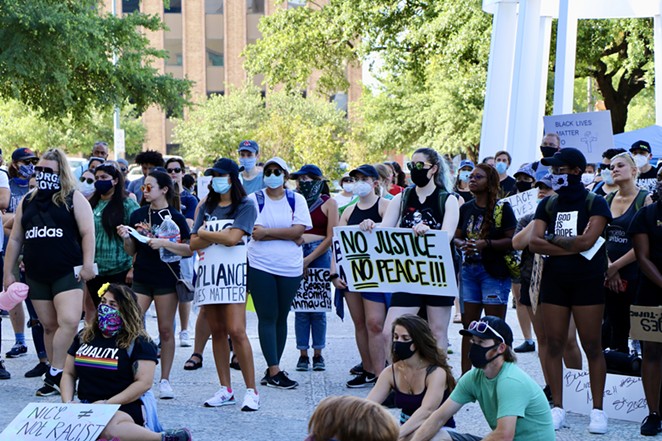 Black Lives Matter supporters listen to a speaker during one of many protests against police violence held in San Antonio last year. - James Dobbins