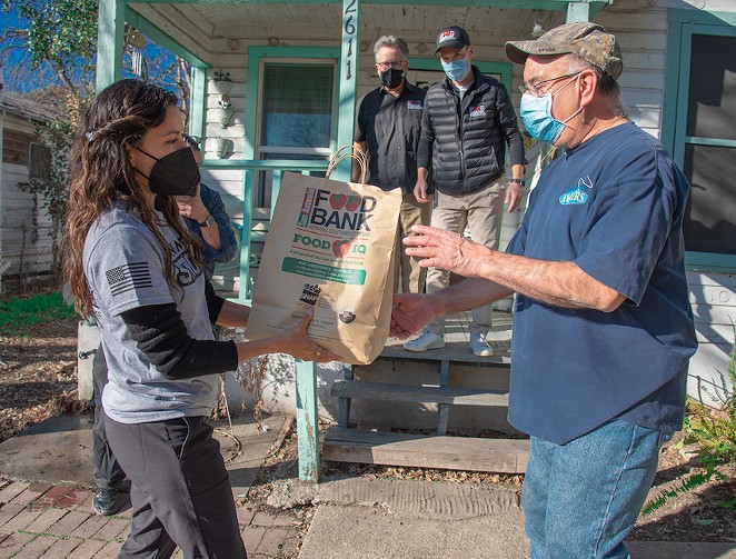 Eva Longoria helps with a San Antonio food distribution. - COURTESY / SAN ANTONIO FOOD BANK