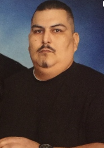 Police say Isidro Zarate was shot and killed when he told a man to stop beating a woman in a Walmart parking lot