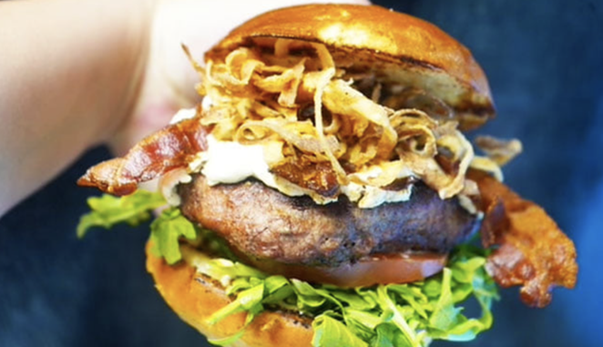 The G.O.A.T. burger features roasted goat cheese, smoky bacon and fried onion strings. - FACEBOOK / FRANKLIN JACK
