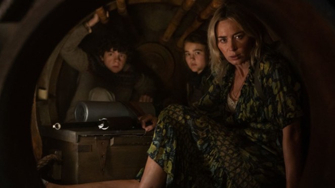 Evelyn (Emily Blunt, far right) and her children, from left, Marcus and Regan, hide inside a furnace to avoid alien attackers in "A Quiet Place Part II" - PARAMOUNT PICTURES