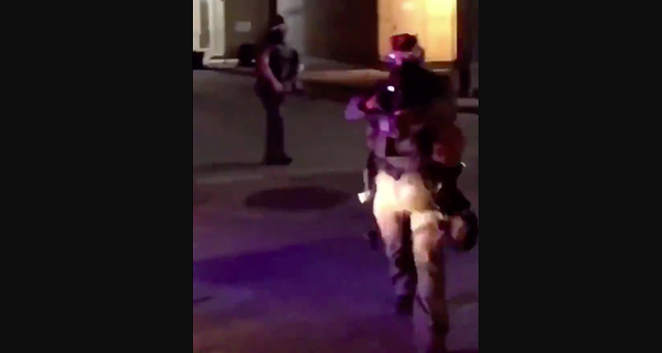 An unidentified officer approaches a person filming a protest in downtown San Antonio last summer. - VIDEO CAPTURE VIA YOUTUBE / JASON MILLER