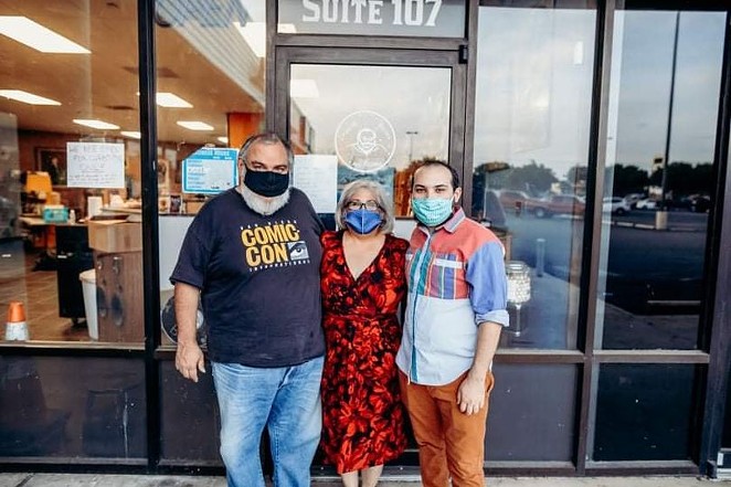 Ezra Hurd (right) and his family stand outside Imagine Books and Records, a retail spot that also doubled as a DIY concert venue for 10 years. - FACEBOOK / IMAGINE BOOKS AND RECORDS
